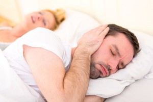 Young man can't sleep because of girlfriend's snoring